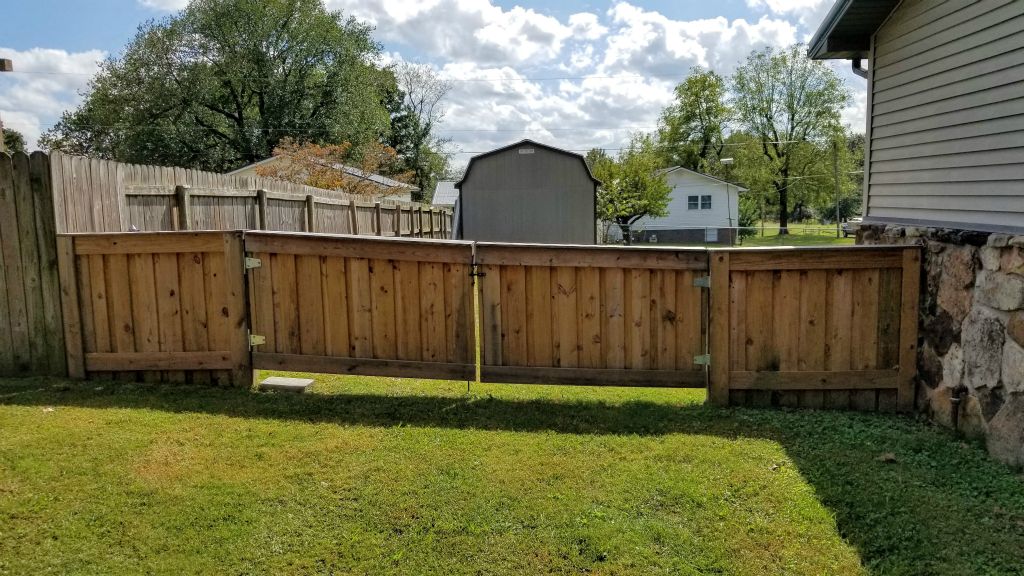 Double Wooden Gates into Backyard