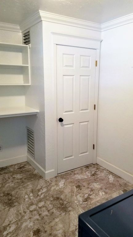 Custom Built-in shelving in Utility Room with Hot Water Closet