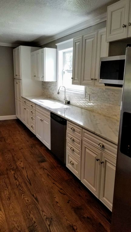 Kitchen with Marble Countertops & New Cabinets