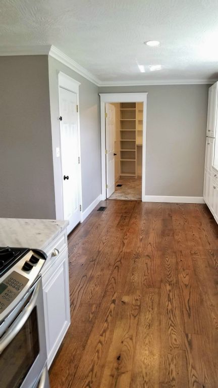 Kitchen Looking towards Carport Entry Door & Utility Room